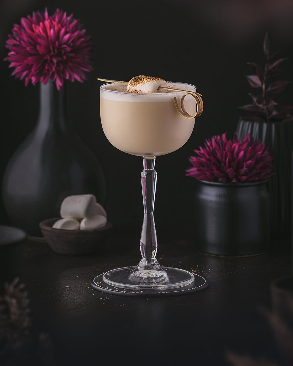 Milk Cocktail with Bourbon Whiskey and Vanilla. Garnished with nutmeg and marshmallow.