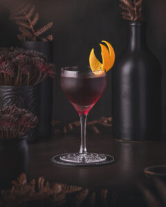 Hanky Panky Cocktail - Deep red Martinez style drink with with Fernet Branca and orange twist garnish.