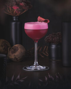 Roman Sour - Rye Whiskey Sour cocktail with red beet. Deep purple red color.