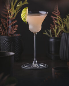 Hemingway Daiquiri - a rose orange cocktail with white rum, grapefruit and lime garnish.