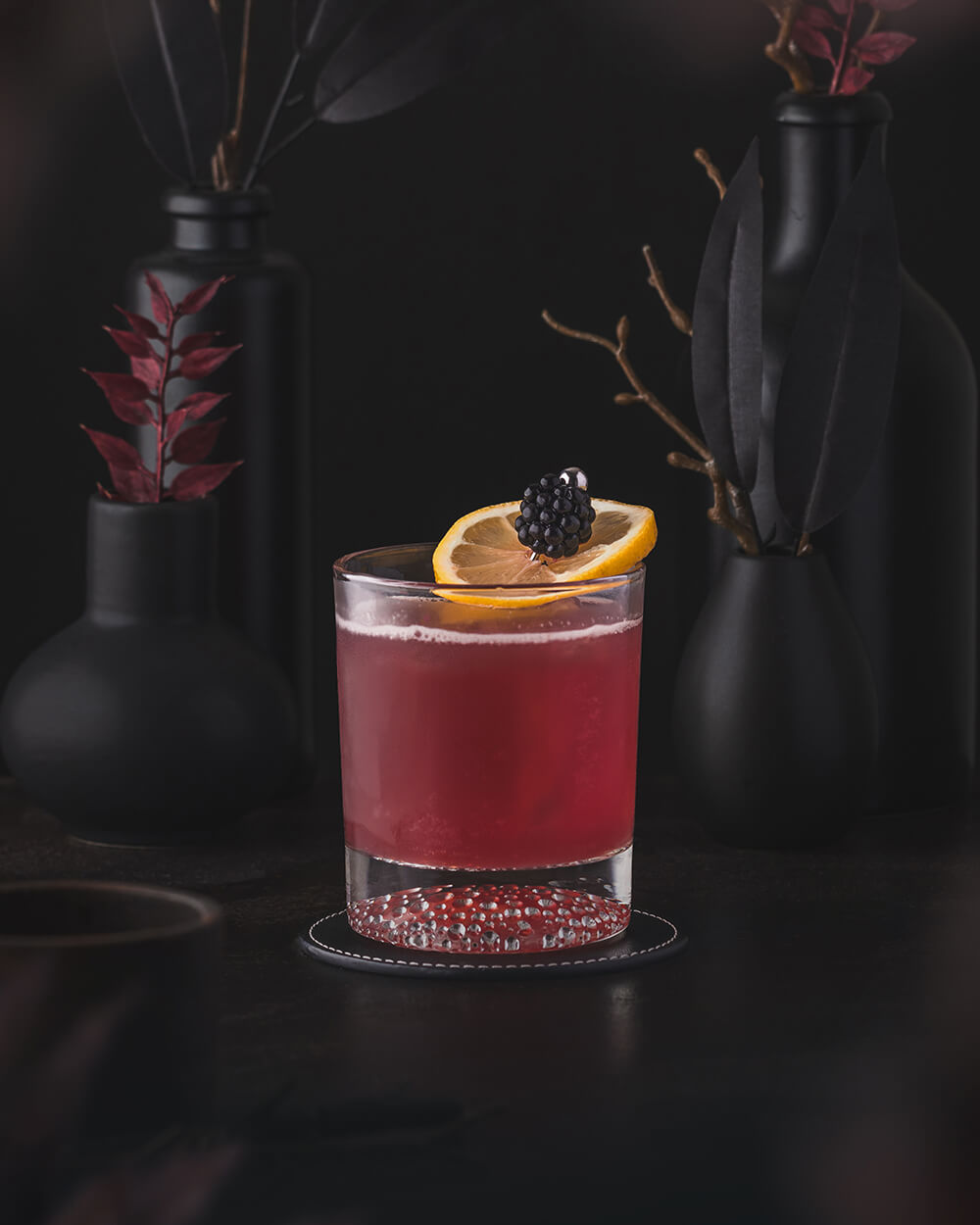 Bourbon Renewal - Red Magenta Cocktail with Bourbon Whiskey and Blackberry and Lemon garnish