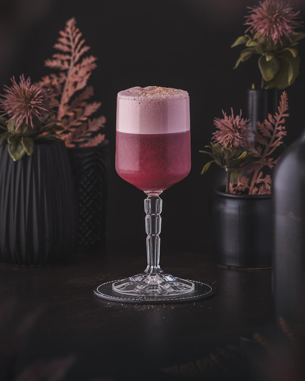 Elk's Own Cocktail - Rye Whiskey based cocktail with red port wine garnished with grated nutmeg. Deep red magenta color.