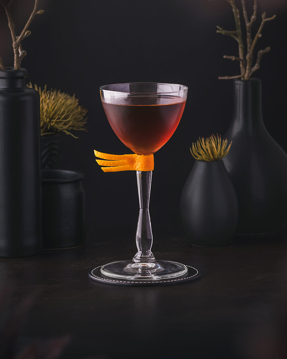 La Viña Cocktail - Deep red drink with rye whiskey, amaro nonino, cream sherry and orange bitters.